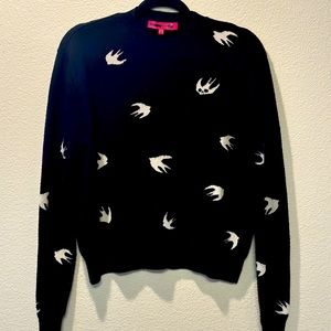 Small black sweater with white birds.